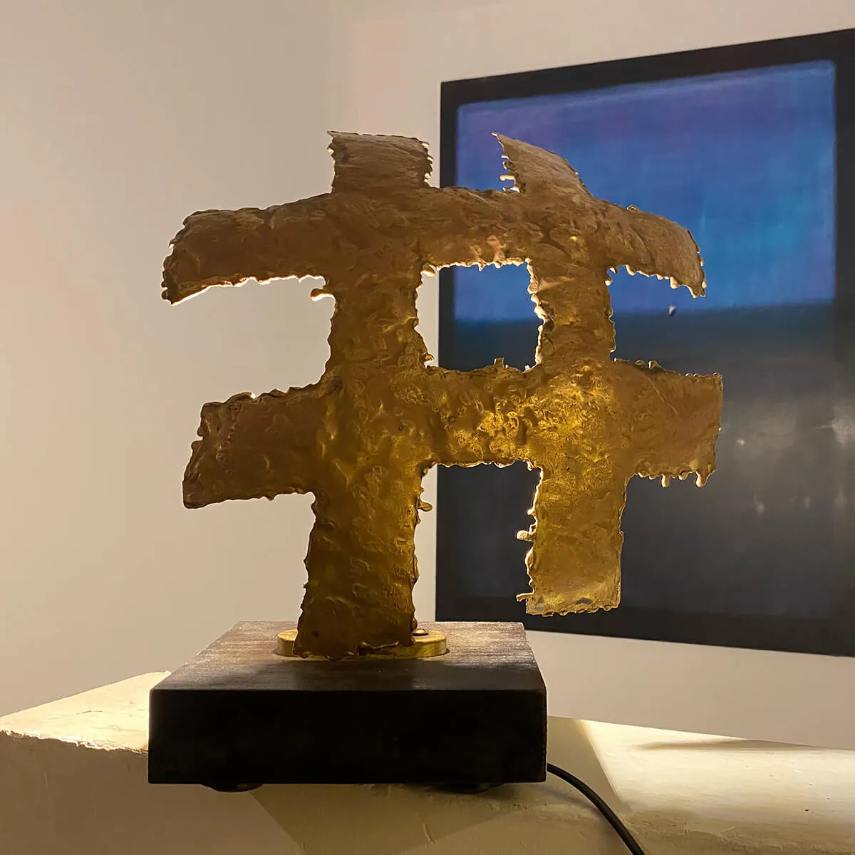 Hashtag - Backlit brass sculpture on wooden base